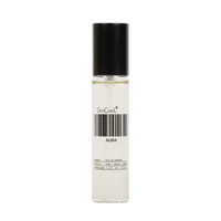 A clear cylindrical perfume bottle with a black cap, containing a very pale liquid. The bottle has a white label with a barcode and the text 'DedCoolt' and 'AURA'.