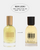 Two bottles of DedCool Sunit Blooms fragrance shown side by side on a light gray background, with a black cap on the right bottle and a gold cap on the left bottle. A white oval at the top reads 'NEW LOOK! SAME FORMULATION AND SCENT YOU LOVE.